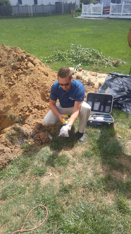 Brad Boorse performing a soil test with a PID meter